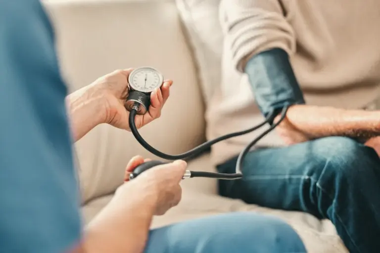 Close-up of a blood pressure check during a visit at home