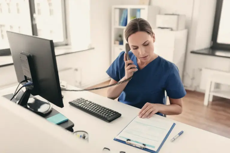 A member of the clinical staff answers a call at the office