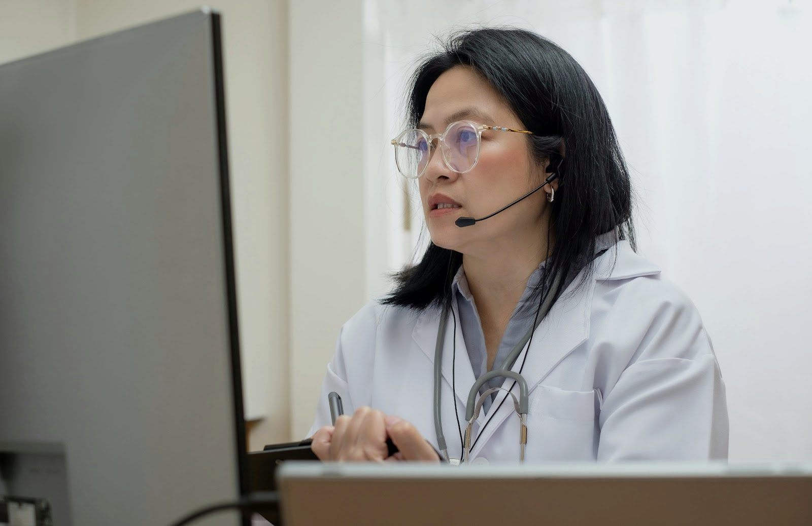 A Nexstep team member takes a call on a headset